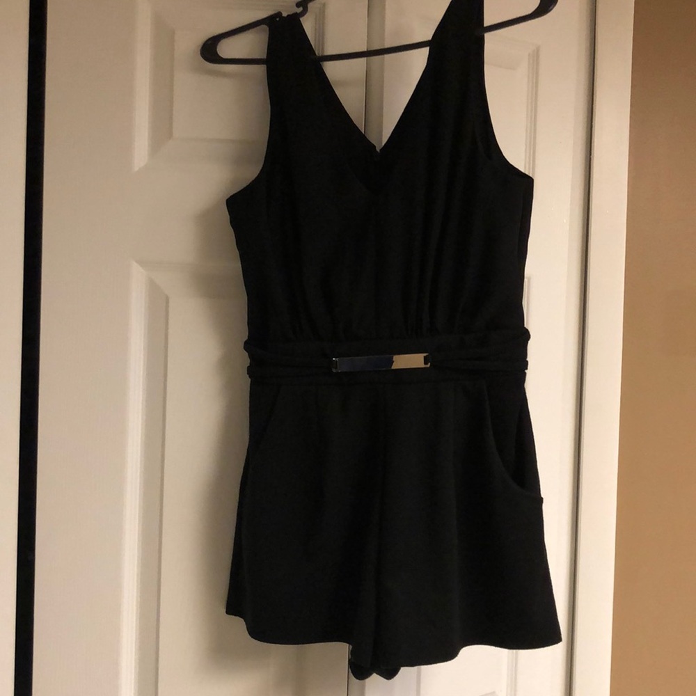 Black romper with gold detail